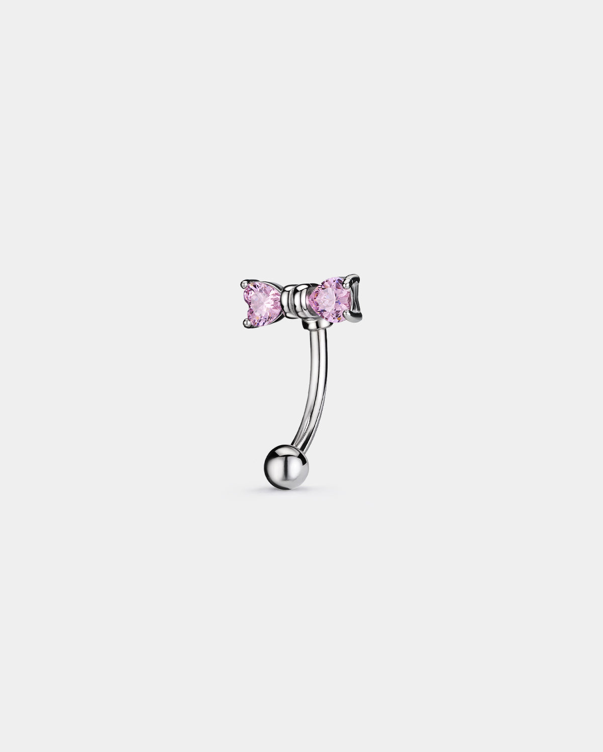 pink bow eyebrow piercing