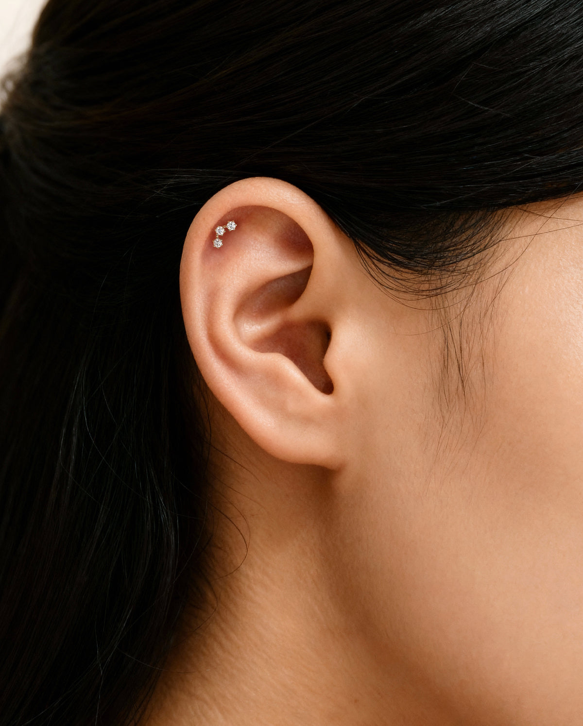 triple moissanite stud piercing