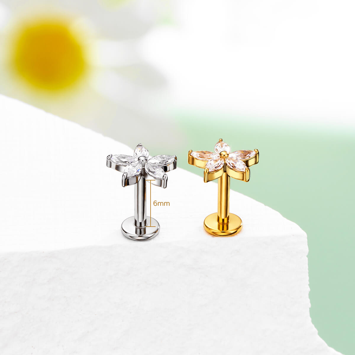 silver and gold flower tragus stud