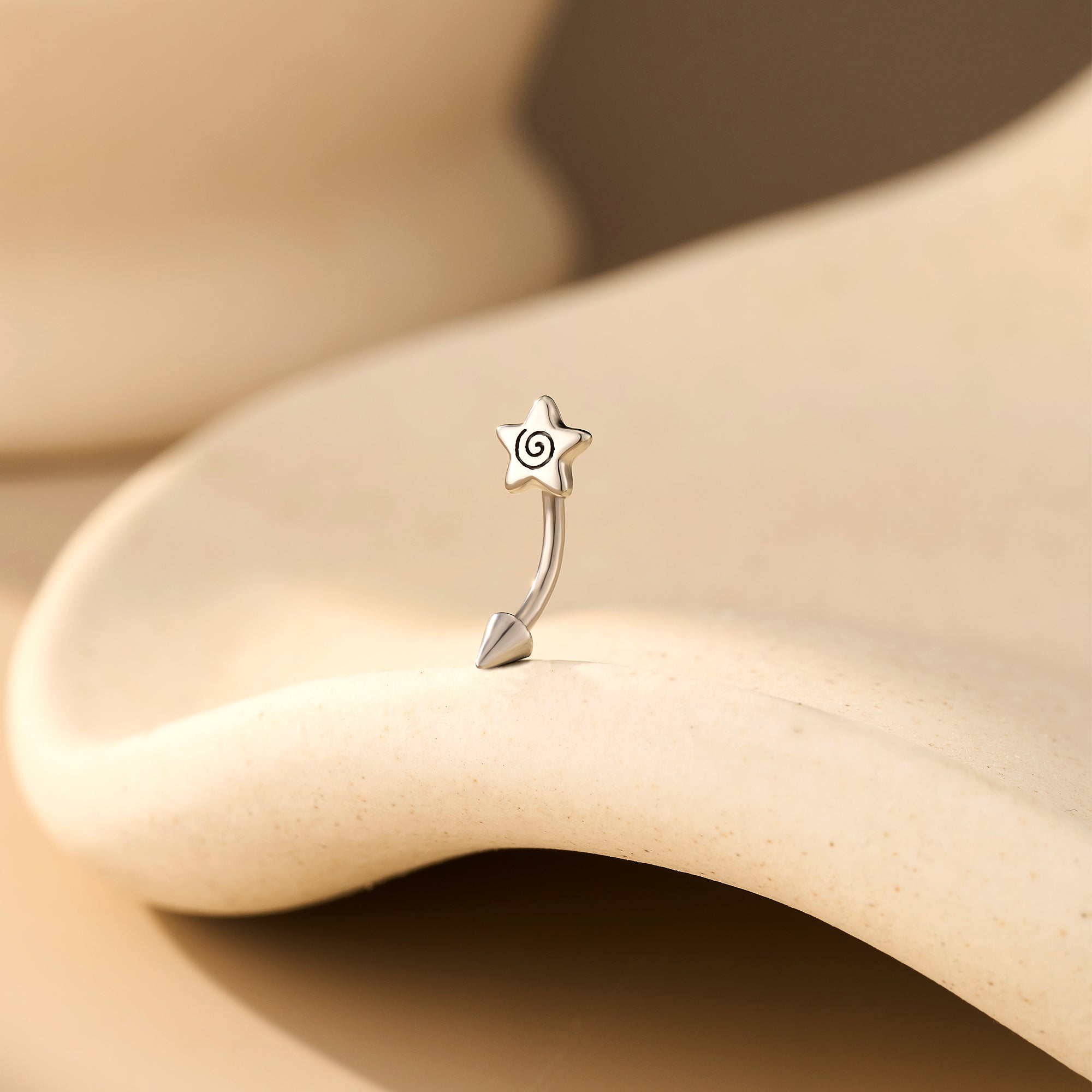 Spiral Star Eyebrow Stud