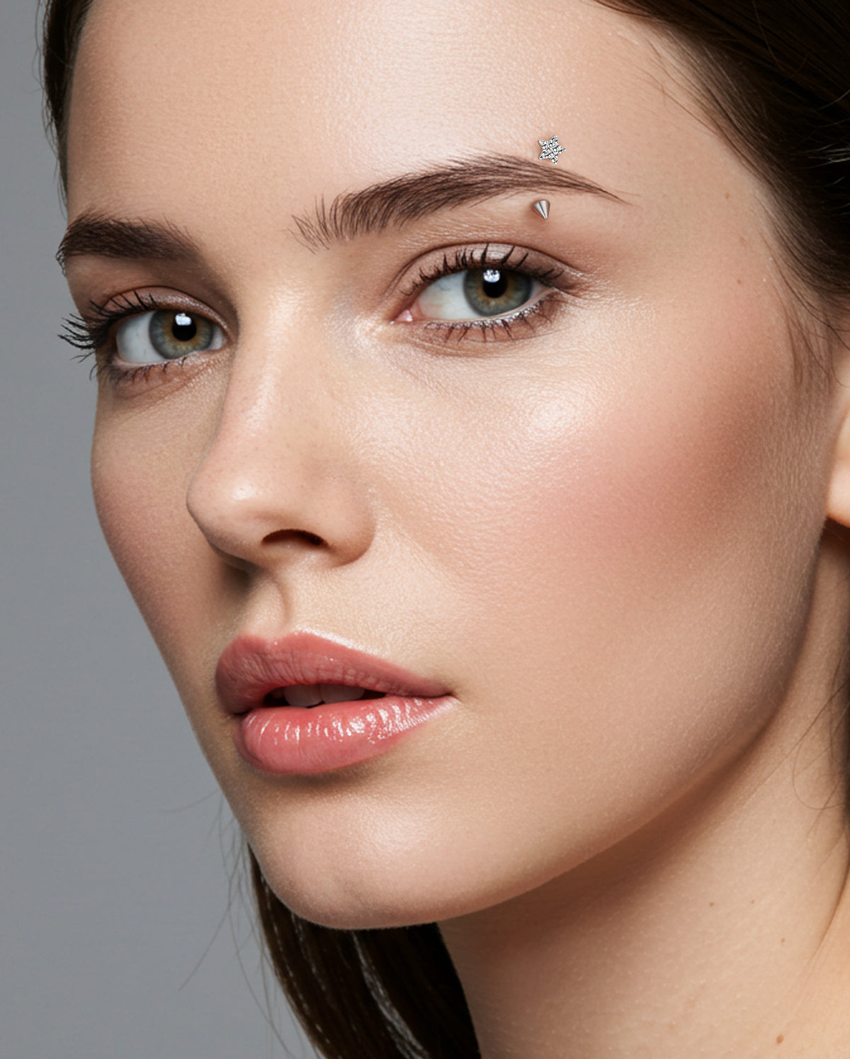 Hammered star eyebrow piercing